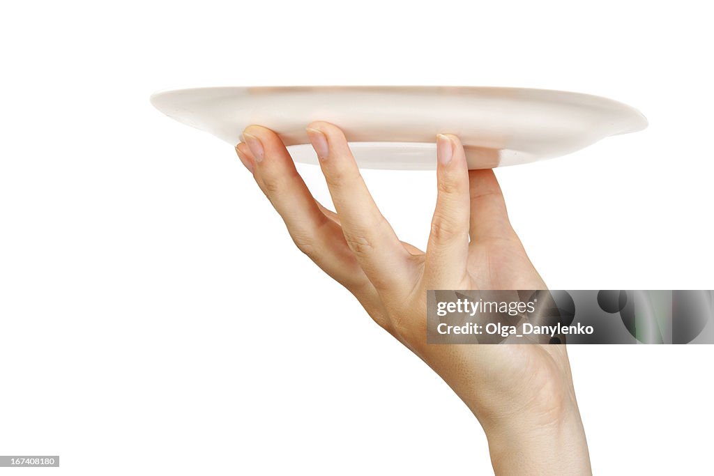 White plate on human hand