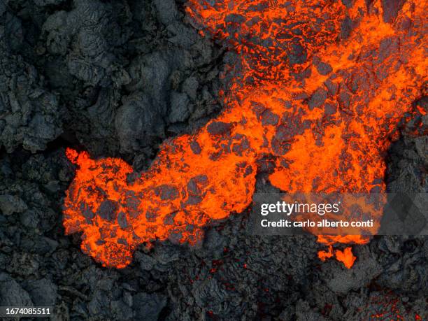 aerial view taken by airplane of litli-hrutur volcano during eruption, reykjanes peninsula, iceland, europe - lava plain stock pictures, royalty-free photos & images