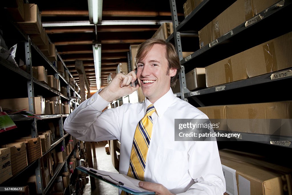 Warehouse man on phone