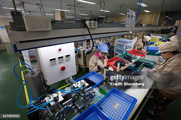 Jangup System Co. Employees work on the production line for manufacturing cosmetic containers at the company's factory in Yongin, South Korea, on...