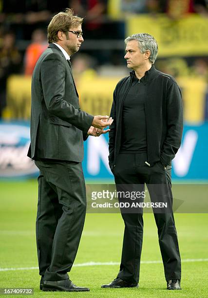 Dortmund's head coach Juergen Klopp chats with Real Madrid's Portuguese coach Jose Mourinho before the UEFA Champions League semi final first leg...