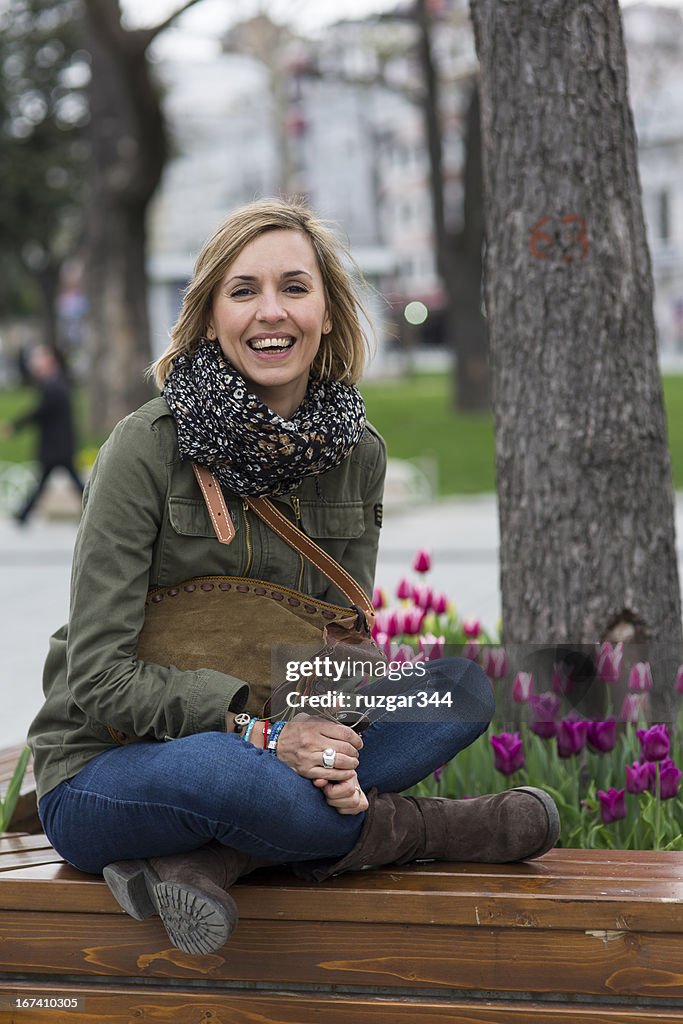 Pretty traveller woman in the park