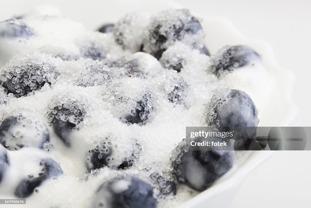 Blueberries whipped cream and sugar