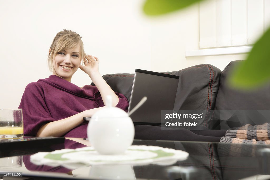 Smiling woman working at home