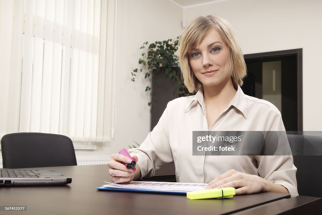 Businesswoman highlighting text