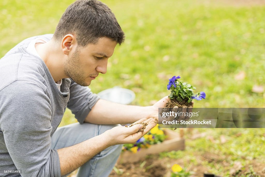 Young gardener planting flowers
