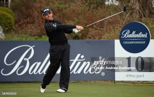 Louis Oosthuizen of South Africa hits his tee-shot on the tenth hole during the first round of the Ballantine's Championship at Blackstone Golf Club...