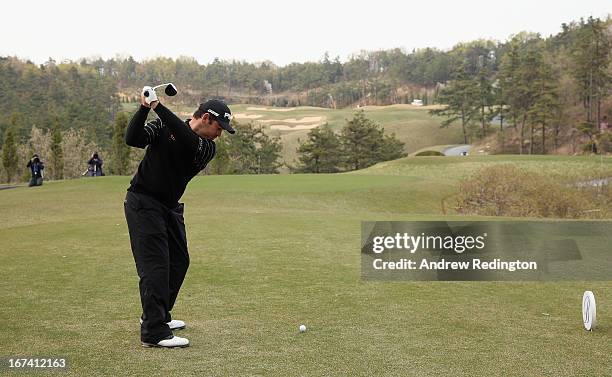 Louis Oosthuizen of South Africa hits his tee-shot on the 11th hole during the first round of the Ballantine's Championship at Blackstone Golf Club...