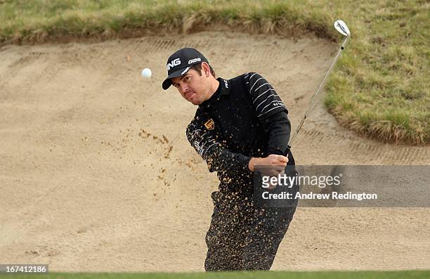 Louis Oosthuizen of South Africa plays a bunker shot on the tenth hole during the first round of the Ballantine's Championship at Blackstone Golf...