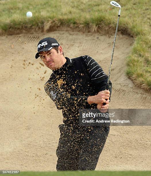 Louis Oosthuizen of South Africa plays a bunker shot on the tenth hole during the first round of the Ballantine's Championship at Blackstone Golf...