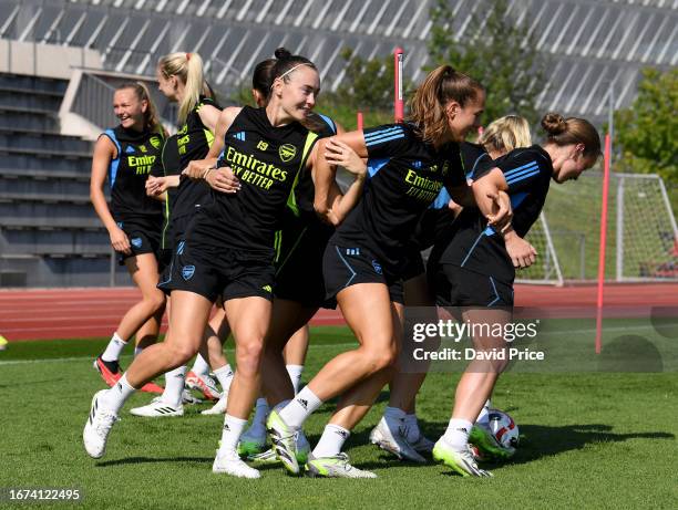 Caitlin Foord, Lia Walti and Kim Little of Arsenal during the Arsenal Women's training session at Adidas Headquarters on September 11, 2023 in...