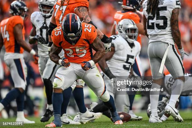 Samaje Perine of the Denver Broncos celebrates after a fourth quarter first down against the Las Vegas Raiders at Empower Field at Mile High on...