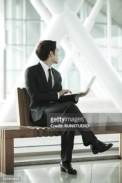 airport business - legs crossed at knee stock pictures, royalty-free photos & images