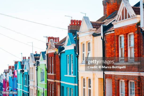 multi-colored townhouses in brighton, uk - east sussex stock pictures, royalty-free photos & images