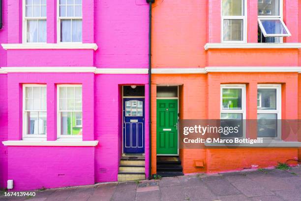 colorful houses in brighton, uk - two houses side by side stock pictures, royalty-free photos & images