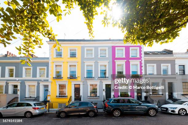 colorful houses at portobello road in notting hill, london, uk - notting hill photos et images de collection