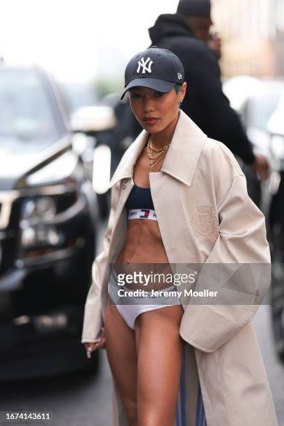 Tommy Hilfiger Fashion Brunch guest was seen wearing an oversized beige Tommy Hilfiger coat combined with Tommy Hilfiger underwear including white...