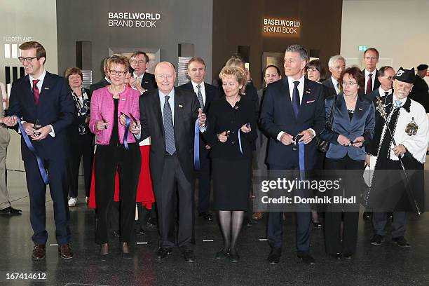 Jacques J. Duchene, Eveline Widmer-Schlumpf, Rene Kamm and Eva Herzog cut the ribbon at the 'Baselworld 2013' at Baselworld on April 25, 2013 in...