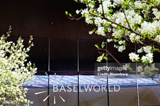 Sign sits above the entrance to a show hall at the Baselworld watch fair in Basel, Switzerland, on Wednesday, April 24, 2013. The annual fair...