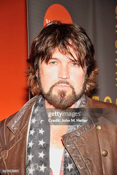 Singer Billy Ray Cyrus signs copies of his new book "Hillbilly Heart" and performs at the New Roads School Moss Theater on April 24, 2013 in Santa...