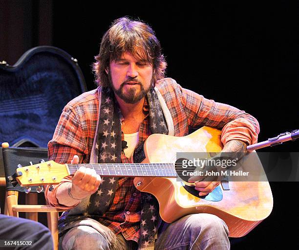 Singer Billy Ray Cyrus performs before his book signing of his new book "Hillbilly Heart" at the New Roads School Moss Theater on April 24, 2013 in...