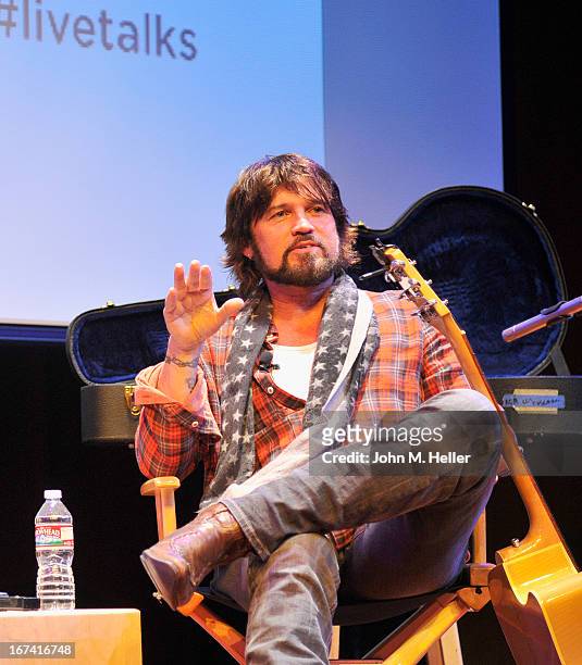 Singer Billy Ray Cyrus performs before his book signing of his new book "Hillbilly Heart" at the New Roads School Moss Theater on April 24, 2013 in...