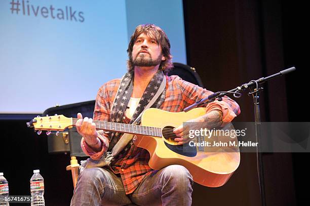 Singer Billy Ray Cyrus performs before his book signing of his new book "Hillbilly Heart" at the New Roads School Moss Theater on April 24, 2013 in...