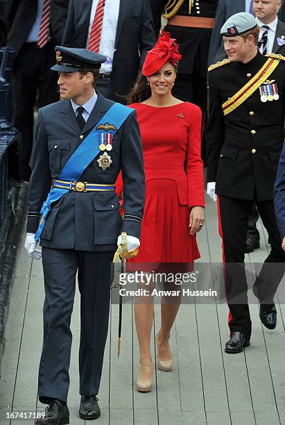 Prince William, Duke of Cambridge, Catherine, Duchess of Cambridge and Prince Harry arrive to board the royal barge 'Spirit of Chartwell' for the...