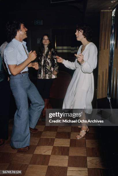 Attendees dance at Hugh Hefner and Stan Herman's private club - 'Pips Disco and Backgammon Club' in Beverly Hills, California, United States, March...