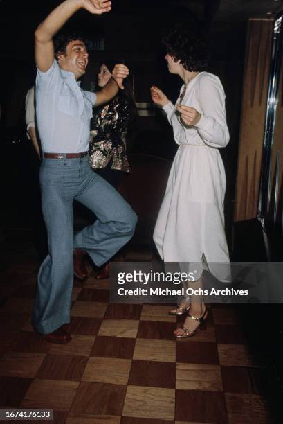 Attendees dance at Hugh Hefner and Stan Herman's private club - 'Pips Disco and Backgammon Club' in Beverly Hills, California, United States, March...