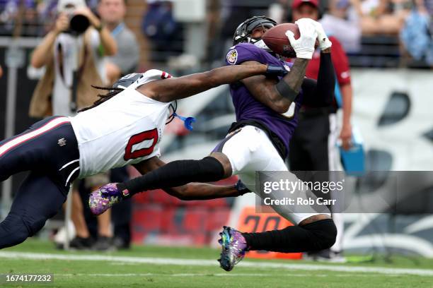 Odell Beckham Jr. #3 of the Baltimore Ravens catches a pass in front of Shaquill Griffin of the Houston Texans at M&T Bank Stadium on September 10,...