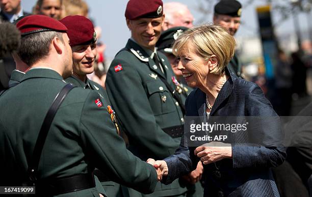 Norwegian Minister of Defence Anne-Grete Strom-Erichsen meets Norwegian military personnel during a wreath-laying ceremony in honour of Norwegian...