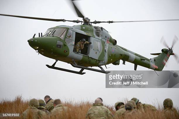 Helicopter hovers during a British And French Airborne Forces joint exercise on April 25, 2013 in Stranraer, Scotland. Exercise 'Joint Warrior' sees...