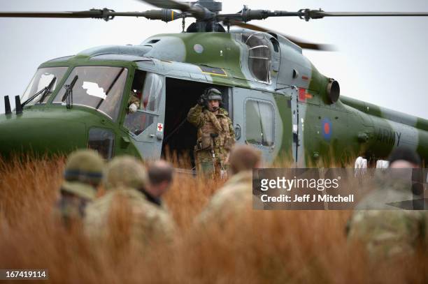 Helicopter lands during a British And French Airborne Forces joint exercise on April 25, 2013 in Stranraer, Scotland. Exercise 'Joint Warrior' sees...