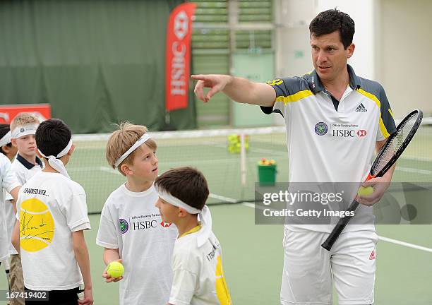 Former British No1 and HSBC Ambassador Tim Henman takes part in HSBC Community Tennis Clinic at Hampshire Health & Racquets Club on April 25, 2013 in...