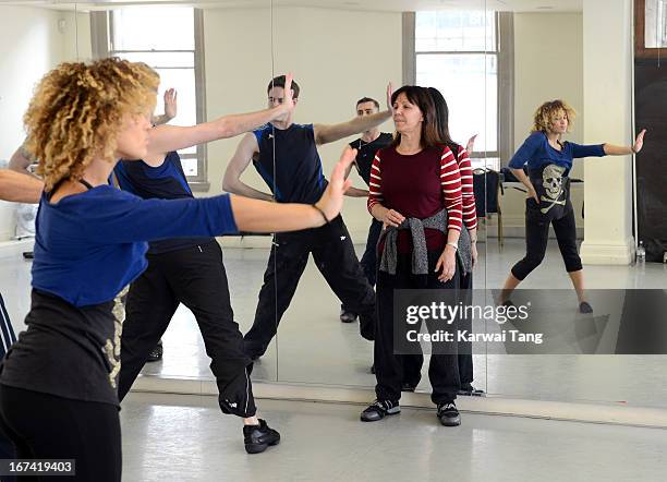 Arlene Phillips choreographs and leads rehearsals of a dance routine to be performed at the Olivier Awards 2013, at The Old Finsbury Town Hall on...