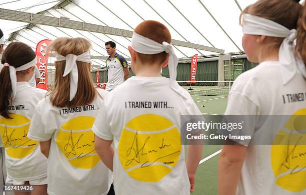 Former British No1 and HSBC Ambassador Tim Henman takes part in HSBC Community Tennis Clinic at Hampshire Health & Racquets Club on April 25, 2013 in...