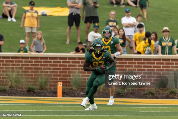 Baylor Bears tight end Kelsey Johnson catches the ball and stats running up field during the college football game between Baylor Bears and LIU...