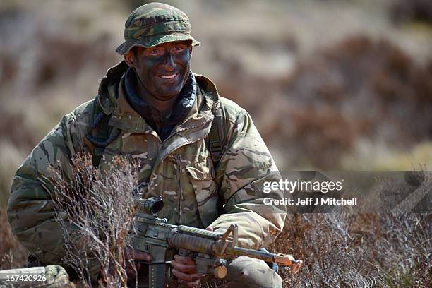 Soldier smiles during a British And French Airborne Forces joint exercise on April 25, 2013 in Stranraer, Scotland. Exercise 'Joint Warrior' sees...