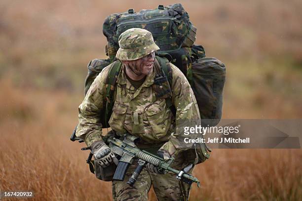 Soldier walks during a British And French Airborne Forces joint exercise on April 25, 2013 in Stranraer, Scotland. Exercise 'Joint Warrior' sees...