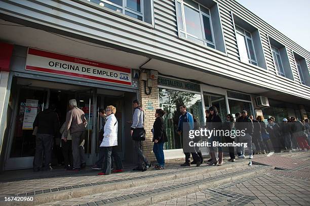 Jobseekers enter an employment office after opening in Madrid, Spain, on Thursday, April 25, 2013. Spanish unemployment rose more than economists...