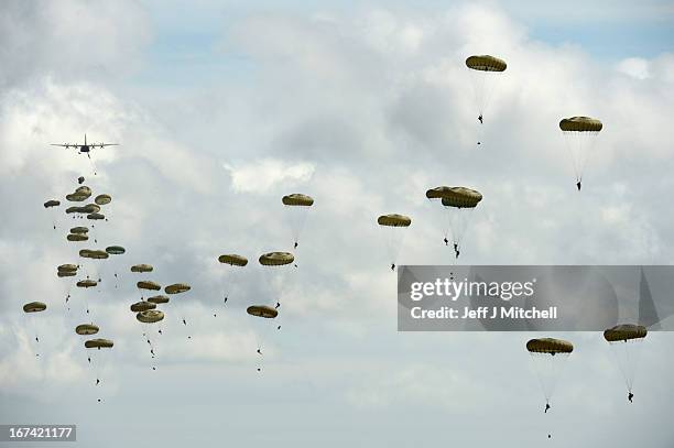 2nd Battalion, Parachute Regiment parachute from an aeroplane during a British And French Airborne Forces joint exercise on April 25, 2013 in...