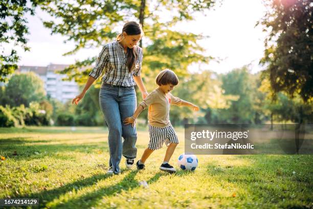 always in the mood for football - family with one child stock pictures, royalty-free photos & images