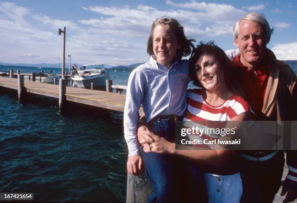 Portrait of San Francisco 49ers head coach Bill Walsh with his wife Geri and daughter Elizabeth during photo shoot on dock. Lake Tahoe, NV 7/9/1982...