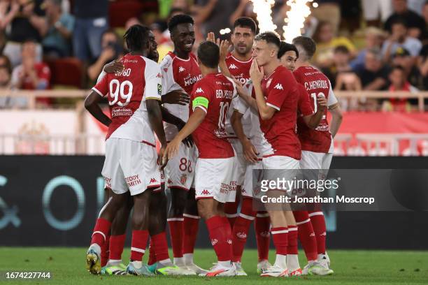 Guillermo Maripan of AS Monaco celebrates with team mates after scoring to give the side a 3-0 lead during the Ligue 1 Uber Eats match between AS...