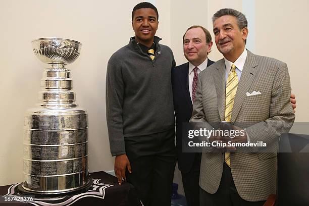 Thurgood Marshall College Fund scholarship winner Donald Shaw III of the Fort Dupont Ice Hockey Club poses for photographs with NHL Commissioner Gary...