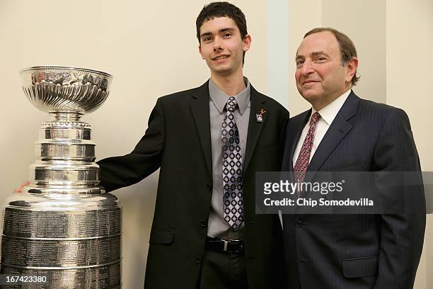 Thurgood Marshall College Fund scholarship winner Richard Lucas of the Ed Snider Hockey Foundation poses for photographs with NHL Commissioner Gary...