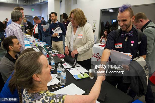 Job seekers talk with recruiters at the Spring LGBT Career Fair in San Francisco, California, U.S., on Wednesday, April 24, 2013. Fewer Americans...