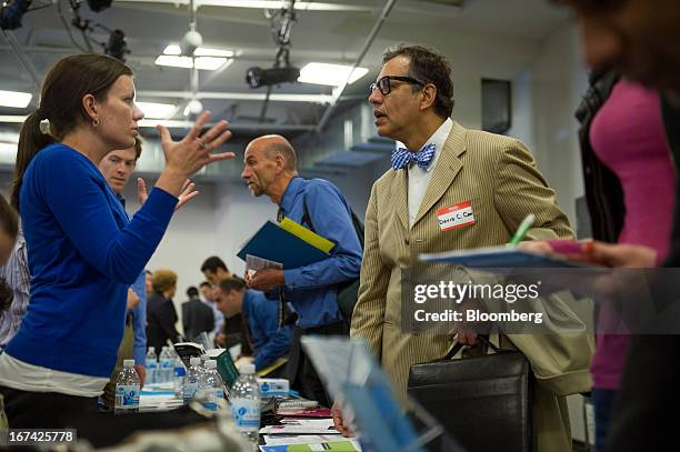 Job seeker David Cano, right, talks with a recruiter at the Spring LGBT Career Fair in San Francisco, California, U.S., on Wednesday, April 24, 2013....