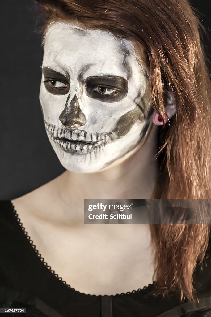 Beautiful woman with halloween mask